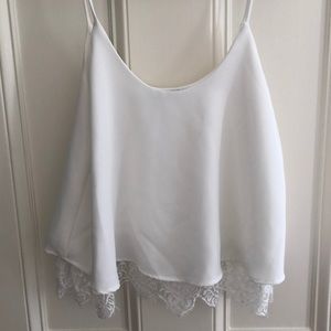 Slightly cropped white lace tank top